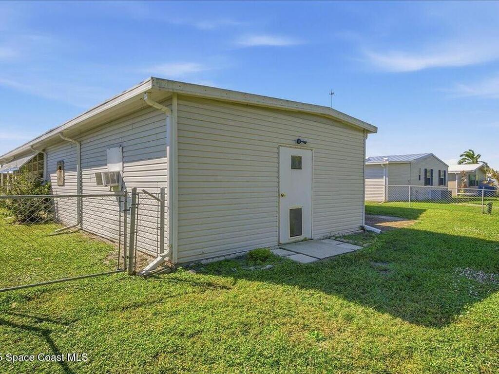 1131 Tequesta Drive, Barefoot Bay, FL 32976