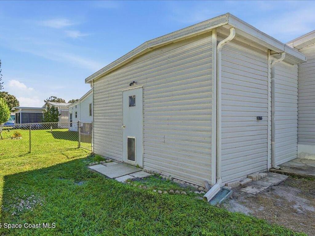 1131 Tequesta Drive, Barefoot Bay, FL 32976