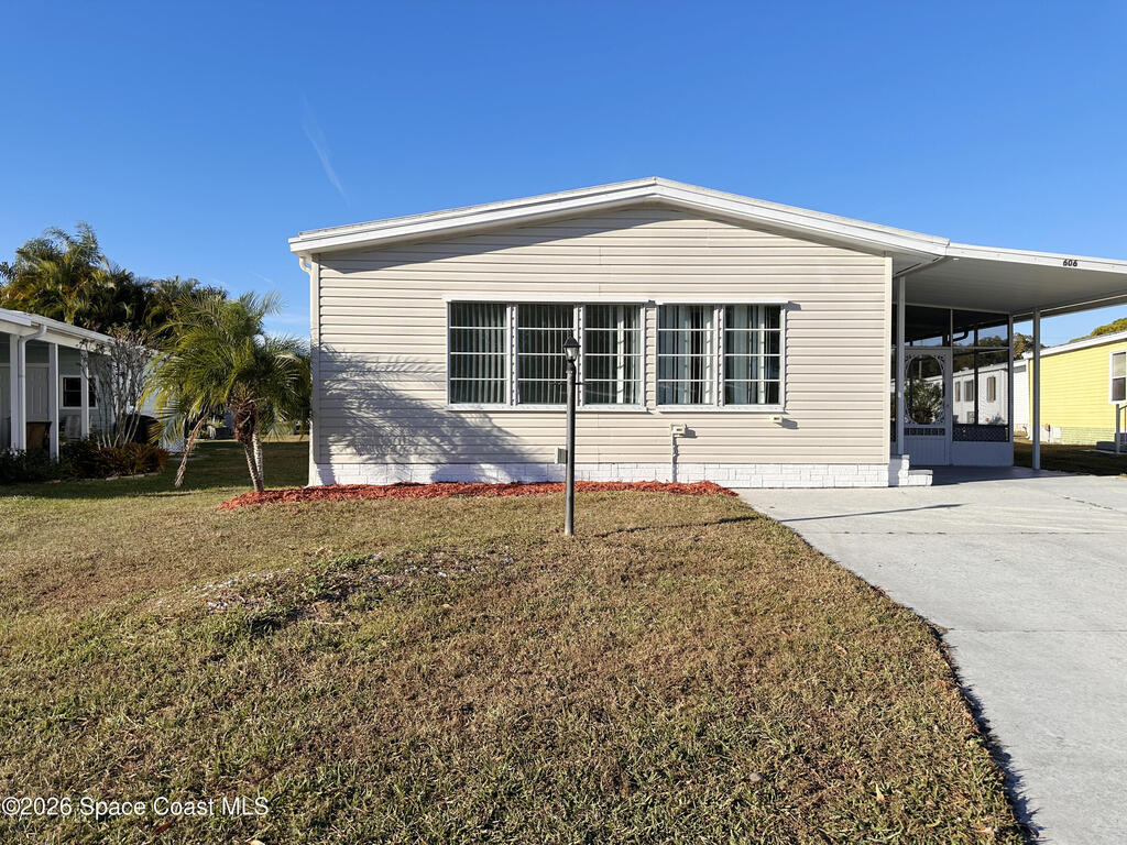 606 Dolphin Circle, Barefoot Bay, FL 32976